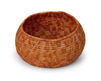 11
A polychrome California Mission basketry bowl
Early 20th century; Southern California
The coiled bowl with all over floral and geometric pattern
4.5" H x 9.75" Dia.
Estimate: $500 - $700