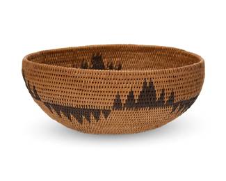 189
A Washoe basketry bowl
Early 20th century; Northern California/Nevada
A coiled low bowl with a central band of alternating irregular sawtooth motifs
3" H x 7.75" Dia.
Estimate: $400 - $600