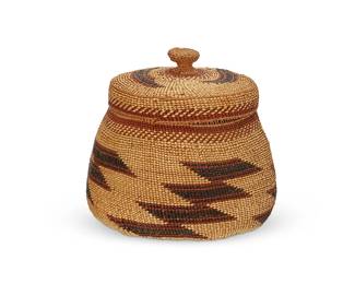 35
A polychrome Hupa/Yurok/Karuk lidded basket
Early/mid-20th century; Northern California
A tall twined basketry jar with diagonally stacked imbricated geometric motifs to body and to lid, with ticking bands and an openwork rim
5.5" H x 6" Dia. approximately
Estimate: $200 - $400