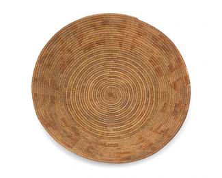 7
A polychrome California Mission basketry tray
Early 20th century; Southern California
A coiled small flared tray with multiple contrasting motifs to sides
1.75" H x 9" Dia.
Estimate: $400 - $600