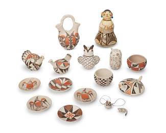 259
A large group of Acoma Pueblo polychrome pottery items
Mid/late 20th century
Three with penciled attribution to underside: Mary Hacia; most marked: Acoma N.M.; or variously: Acoma / Sky City
Comprising two small bowls and a turtle effigy figure by Maria Hacia, a female figural effigy with beaded ear adornments, a wedding vase, two chicken effigy figures, two owl effigy figures, miniature snake and owl figures, and five trays with various avian and geometric motifs
16 pieces
Female figure: 6.875" H x 4.375" Dia.; Largest bowl: 2.375" H x 3.625" Dia.
Estimate: $300 - $500