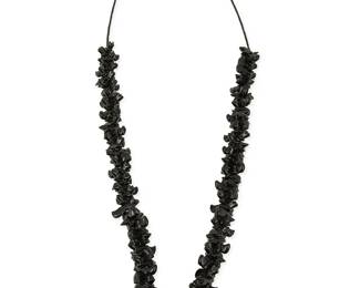 281
A Southwest Pueblo carved jet fetish necklace
Late 20th century
Featuring a single strand necklace of stacked graduated carved black jet animal figures, including bears, wolves, and foxes, with a central carved jet turtle, and with jet heishi beads and a silver cone and hook clasp
30" L x 1.375" H
63.9 grams gross
Estimate: $200 - $400