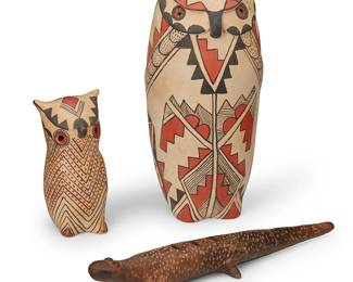 258
Two Jemez Pueblo pottery owls and a pottery lizard ocarina
Three works:
Persingula M. Gachupin (1910-1994, Jemez Pueblo)
Two polychrome painted pottery owl figures, mid/late 20th century
Each variously marked to base: Mrs. P.M.G. / Jemez Pue. / N.M.
The three-color figures, comprising two tall tanware owl sculptures with elaborate painted line and stepped rain, cloud, feathers, and other Pueblo motifs
2 pieces
Larger: 11" H x 5.25" W x 5" D; Smaller: 5.75" H x 2.75" W x 2.75" D
A pottery lizard ocarina flute, 20th century
Unmarked
The figural flute with incised texture to body
1.75" H x 3" W x 12.5" D
3 pieces total
Estimate: $200 - $400