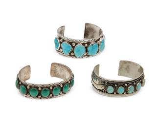 223
Three Southwest-style silver and set stone cuff bracelets
Late 20th century
Variously marked for sterling and for maker: S.E. [likely Sensa Eustace, Zuni] / SS/Hecho en Mexico
Comprising two chunky sterling silver cuffs with incised edging and silver ball accents, including a Sensa Eustace Zuni cuff with large row set graduated turquoise and a cuff with row set malachite cabochons, as well as a Mexican silver cuff with row-set turquoise and silver feather overlay accents to terminals
3 pieces
Largest: 7.25" inner C x 1" H, with a 1.25" gap; smallest: 6.75" inner C x 0.75" H, with a 1" gap
131.4 grams gross
Estimate: $600 - $900