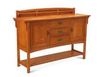 62
A Contemporary Mission-style sideboard
Early 21st century
With burn mark to upper drawer interior: Bassett / Made in USA; numbered with factory stencil verso
The wood sideboard with brass hardware, featuring an upper plate rack mounted to a corbeled top surface, above three drawers centering opposed hinged cabinet doors, raised on four legs joined by an undershelf
42.5" H x 60.25" W x 17.25" D
Estimate: $800 - $1,200