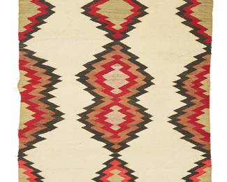 199
A Navajo regional rug/double saddle blanket
Early/mid-20th century, Diné
Woven in red, cream, black, brown, and green wool with columns of stacked serrated diamonds
35.5" H x 47" W
Estimate: $300 - $500