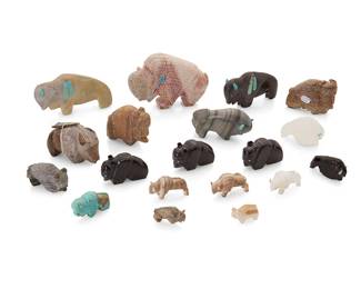 321
A group of Zuni carved stone buffalo fetish figures
Mid/late 20th century
Some variously labeled for or signed by the artist
Comprising nineteen buffalo figures in various stones from various makers such as Emory Boone, Jane Quam, Mildred Cadman, Frank Tom, Gilbert Lonjose, and Raybert Kanteena, one with stone inlay heartline, most with turquoise inlaid features and accents, and one mounted with offerings
19 pieces
Largest: 3" H x 4.5" W x 1" D; Smallest: 0.75" H x 1.125" W x 0.375" D
Estimate: $200 - $400