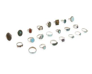 358
A group of Southwest silver and set stone rings
Mid/late 20th century
Five variously marked for maker: Paloma / M / JL / DD [conjoined]; four marked for sterling
A large group of rings featuring various stones including turquoise, lapis lazuli, opal, red stone, and mother of pearl in various styles including bezel-set, cluster-set, mosaic inlay, and silver overlay
22 pieces
Ring sizes: 8 to 5
89.8 grams gross
Estimate: $200 - $400