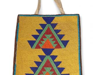 26
A Plateau beaded bag
Early/mid-20th century; Northwest United States
A multi-colored rectangular bag with the front featuring geometric motifs worked in beads of blue, green, red, and orange on a yellow field, with two hide handles, and with velvet edge binding, a quilted velvet back, and pink sateen lining
10" H x 8.5" W
Estimate: $200 - $400