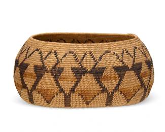 8
A polychrome California Mission pictorial basket
Early 20th century; Southern California
A large coiled oval bowl with a wide band of multicolored stylized floral/faunal motifs to sides
5" H x 11.5" W x 9" D
Estimate: $800 - $1,200