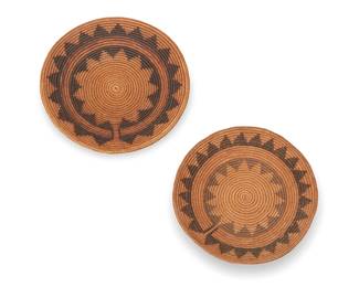 342
Two polychrome Navajo wedding baskets
Early/mid-20th century, Diné
Comprising two coiled basketry trays with banded star motifs
2 pieces
Larger: 4.5" H x 17.5" Dia.; Smaller: 3.5" H x 16.5" Dia.
Estimate: $300 - $500