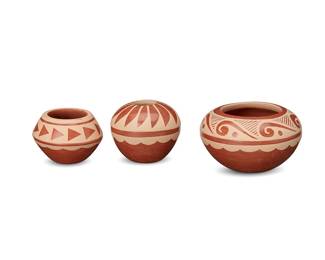 260
Caroline Loretto (b.1953, Jemez Pueblo)
Three redware pottery seed pots, early 21st century
Each signed to underside: C. Loretto Jemez
Each with various white slip decorations on red buff
3 pieces
Largest: 2.375" H x 4.125" Dia.; Smallest: 2" H x 2.75" Dia.
Estimate: $200 - $400