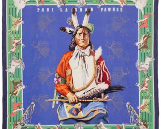 24
A framed vintage Hermès "Pani La Shar Pawnee" Carré silk scarf
Circa 1984; France
Marked in the weave: Hermès-Paris / Oliver
Designed by Kermit Oliver (b.1943), and entitled "Pani La Shar Pawnee", the silk twill scarf with hand-rolled edges, signed in plate, "Oliver," in blues, greens and reds, designed with a central figure of a seated Pawnee chief on a deep blue field with fine line printed gold figures, and a green and multicolored border with various figures on horseback, professionally mounted and framed behind plexiglas
Scarf: 35" H x 34.5" W
Estimate: $500 - $700