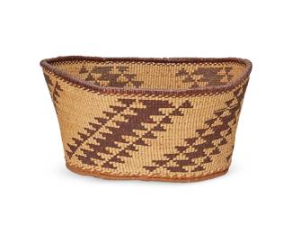 159
A polychrome Pit River basket
Early 20th century; Northeast California
A large oval twined basket with diagonal sawtooth columns in red and yellow overlay and a thick redbud edge rod rim with ticking stripe below
6" H x 11" W x 11" D
Estimate: $200 - $400