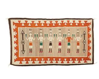 210
A Navajo Yei textile
Mid/late 20th century, Diné
Woven in grey, orange, cream, brown, black, and red wool depicting six Yei figures and diamond/arrow motifs with a complex zigzag stepped border
45" H x 79" W
Estimate: $1,000 - $2,000
