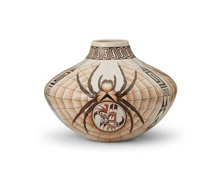 28
Burel Naha (b. 1944, Hopi-Tewa)
A Hopi polychrome pottery bowl, late 20th/21st century
Signed to base with artist's katsina and feather marks
The narrow-necked olla jar with elongated shoulders, featuring three spider and web motifs, and geometric banding to sides and neck
7.25" H x 9.75" Dia.
Estimate: $800 - $1,200