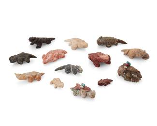 266
A group of Zuni carved stone horned toad fetish figures
Mid/late 20th century
Some variously signed or labelled to base for artist
Comprising twelve horned toad or lizard figures and a single carved (likely) mole fetish from artists including Louise Singer, Avrill/Avriel Lamy, and Carl Estate, most with turquoise inlaid features, and two mounted with offerings
13 pieces
Largest: 0.75" H x 3" W x 1.75" D; Smallest: 0.25" H x 1.25" W x 0.875" D
Estimate: $200 - $400