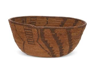 311
An Apache basketry bowl
Early 20th century; Southwest United States
A finely coiled tapered bowl with stepped swirls radiating from the center alternating with irregular geometric motifs
3.75" H x 8" Dia.
Estimate: $400 - $600