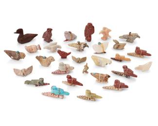357
A group of Zuni carved stone and wood bird fetish figures
Mid/late 20th century
Some variously labeled for or signed by the artist
Comprising twenty-nine bird figures including eagles, ducks, an owl, a hummingbird and others, from various makers such as Gerald Burns, Gabriel Burns, Lorendina Seche, Lena Boone, Jessie LeBeouf, Elfina Hustito, Herbert Hustito, and Virginia Quam, most with turquoise inlaid features, seventeen mounted with offerings
29 pieces
Largest: 1.875" H x 3" W x 1" D; Smallest: 0.625" H x 1.25" W x 0.5" D
Estimate: $200 - $400