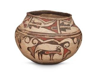 247
A Zuni Pueblo polychrome pottery olla
Late 19th/early 20th century
The three-color jar with red and dark brown heartline dear, avian, and rain cloud motifs on a white slip ground, above a puki indentation to underside
7.375" H x 9.75" Dia.
Estimate: $600 - $900