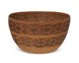 186
A polychrome Yokuts basket
Early 20th century; Central California
A coiled gap-stitched tapered basketry bowl with two wide bands of "rattlesnake" diamond motifs
6" H x 11" Dia.
Estimate: $400 - $600
