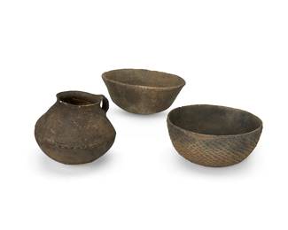 373
Three Southwest pottery vessels
Prehistoric or later
The corrugated ware items, comprising a handled jar with flared rim and two bowls
3 pieces
Jar: 7" H x 7.25" Dia.; Wider bowl: 4" H x 9.25" Dia.
Estimate: $200 - $400