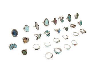 379
A group of Southwest silver and set stone rings
Mid/late 20th century
Five variously marked for maker: PJ / DY / FP [with arrow; for Fred Peshlaki, Navajo/Diné, c.1896-1974] / JM / RG+; six marked for sterling
A large group featuring various stones including turquoise, coral, sodalite, mother of pearl, and onyx, in various styles including bezel-set, cluster-set, mosaic inlay, and silver overlay, and figural motifs including a spider
27 pieces
Ring sizes: 8 to 4
111.9 grams gross
Estimate: $200 - $400