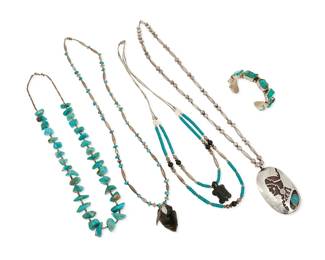 270
A group of Southwest-style jewelry
Late 20th century
Four works:

A Lennie Parker Navajo portrait pendant necklace
Lennie Parker (b. 20th century, Diné)
Stamped: LP [conjoined; within arrowhead]
A large oval pendant with shadowbox silver overlay portrait motif and bezel set turquoise, suspended from a strand of silver ball and oblong beads
27" L x 3.125" H

A group of Southwest-style jewelry
Unmarked
Comprising a silver-toned metal cuff with set turquoise-colored stones (7" inner C x 0.625" H, with a 1.25" gap), together with a double strand of turquoise, silver-toned and mother of pearl beads with a carved black stone turtle pendant (25" L), as well as a single strand of silver-toned and turquoise beads with a chip carved obsidian arrowhead pendant (28" L), and a single strand of turquoise nuggets with shell heishi spacers (24" L), 4 pieces

5 pieces total
261.3 grams gross
Estimate: $300 - $500