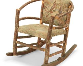 275
An Old Hickory-style rocking chair
Mid-20th century
The natural wood horseshoe armchair set on carved wood rockers, featuring seatbacks and seat cushions upholstered in cotton fabric depicting ducks in a lakeside landscape
30.75" H x 28" W x 36" D
Estimate: $300 - $500