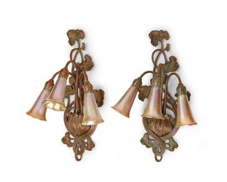 279
A pair of Buffalo Studios wall sconces
Late 20th century
Each unmarked
The Tiffany-style patinated bronze three-light wall sconces, each light with an art glass floriform shade, electrified
2 pieces
Each: 18.25" H x 11.25" W x 7.75" D
Estimate: $1,000 - $1,500