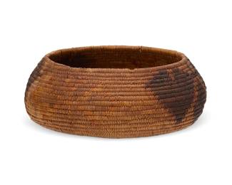 12
A polychrome California Mission pictorial basket
Early 20th century; Southern California
A coiled low bowl with contrasting leaf and butterfly motifs to sides and floral motif to base
2.5" H x 6.5" Dia.
Estimate: $400 - $600
