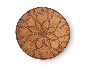 304
An Apache pictorial basketry tray
Early 20th century; Southwest United States
A coiled tray with central flower motif and alternating figural motifs to edges, with dimpled base
2.5" H x 13" Dia.
Estimate: $500 - $700