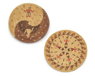 345
Two polychrome Navajo pictorial baskets
Mid/late 20th century, Diné
Two coiled trays comprising one with swirled day/night colored fields with stars and a howling coyote (3" H x 13.75" Dia.), and one with five Yei figures to center and a band of animal motifs to edge (1.5" H x 14.25" Dia.)
2 pieces
Estimate: $400 - $600