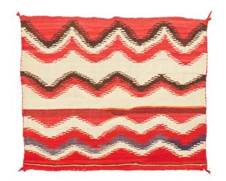 198
A Navajo saddle blanket
Late 19th/early 20th century, Diné
Woven in red, brown, cream, and blue wool, with multiple finely serrated bands
31.5" H x 41" W
Estimate: $600 - $900