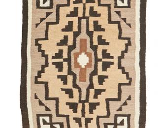 214
A small Navajo Two Grey Hills textile
Mid-20th century, Diné
Woven in cream, tan, grey, and black wool with a central stepped diamond motif and floating stepped motifs to corners
42.5" H x 27" W
Estimate: $200 - $400