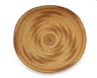 43
A large Hupa/Yurok/Karuk basketry tray
Early 20th century; Northern California
A twined flared tray with three swirled stepped zigzag arms radiating from the center and with ticking accents and banding to edge
5-6" H x 16.75" Dia. approximately
Estimate: $400 - $600