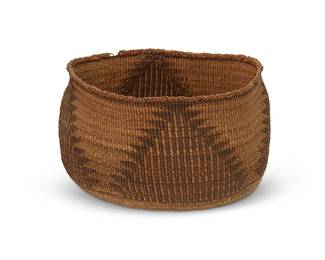 154
A polychrome Klamath basket
Early 20th century; Northern California/Oregon
A twined low bowl with four hooked striped triangle motifs to sides and a band of triangles and a star motif to base
4.125" H x 7" Dia. approximately
Estimate: $200 - $400