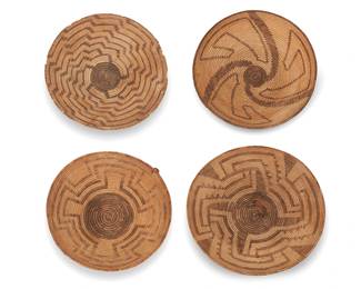336
A group of Pima & Papago Southwest baskets
Late 19th/early 20th century, Akimel O'odham & Tohono O'odham; Southwest United States
Four works comprising three Pima coiled basketry bowls including a low tray with stepped radiating star motif (2.875" H x 15" Dia.), a tapered bowl with three swirling arms and geometric motifs (4" H x 13" Dia.), and a small tray with radiating stepped zigzag arms issuing from center (3.25" H x 11.75" Dia.), as well as a Papago basketry tray with four-directional concentric stepped bands (3.5" H x 12.75" Dia.)
4 pieces
Estimate: $400 - $600