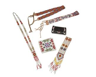 234
A group of Native American beaded dress accessories
Early/mid-20th century
Six works comprising two beaded headbands with hide laces, one in blue, red, yellow, and black beaded diamond motifs, and one in red, white, and blue beads with stepped arrow motifs (23.5" L & 21.5" L; each: 1.25" H), as well as a white, yellow, and blue beaded hide bracelet with fringing (10.5" L x 1.75" H), a white, red, and green beaded necklace (30" L x 4.5" H), and two beaded leather fold wallets, one larger in in white with multicolored floral motifs, and one in black suede with black, red, and white geometric beaded edging (each opened: 3.75" H x 8" W & 4.25" H x 5.25" W)
6 pieces
Estimate: $200 - $400