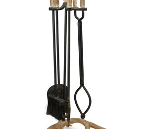 59
A set of carved antler fireplace tools
Late 20th century
Each enameled metal tool with carved antler handle, comprising a shovel, a broom, a fire poker, and tongs, set in a conforming stand with antler base
Overall: 33.25" H x 19" W x 14" D
Estimate: $200 - $400