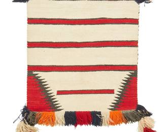 208
A Navajo "Sunday" saddle blanket
Early 20th century, Diné
Woven in cream, red, and grey wool with red banding and serrated corner motifs, featuring multicolored yarn "Sunday saddle" fringe to one edge, and tiered yarn tassels to two corners
30.5" H x 30" W; fringe: 4"; tassels: 11" approximately
Estimate: $400 - $600