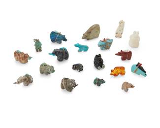 284
A group of small Zuni carved stone bear fetish figures
Mid/late 20th century
Some variously labelled for and one signed by the artist
Comprising nineteen diminutive bear figures in various poses including fishing bears, standing bears and sitting bears in turquoise, jet, amber, antler, and other stones, from various makers such as Vince Chavez, Jackie Norton, Melissa Quam, D. Leonard, [ ] Lasiloo, and Arnie & Claudia Calavaza, most with turquoise inlaid features, and ten mounted with offerings
19 pieces
Largest: 1.375" H x 2" W x 0.625" D; Smallest: 0.625" H x 0.875" W x 0.25" D
Estimate: $200 - $400