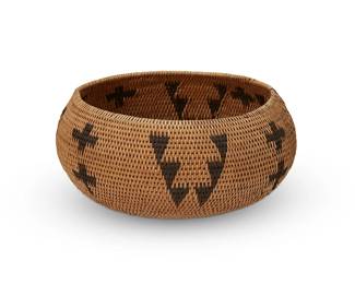 190
A Washoe basket
Early 20th century; Northern California/Nevada
A coiled single rod bowl with alternating bands of stacked crosses and stepped chevrons
3.5" H x 7.25" Dia.
Estimate: $200 - $400
