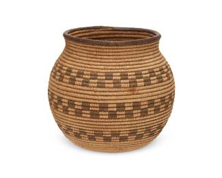 119
A Chemehuevi basketry olla
Early 20th century; Great Basin/Southwest United States
A coiled globular jar with three bands of linked squares
5" H x 5.5" Dia.
Estimate: $500 - $700