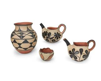 257
A group of Santo Domingo Pueblo polychrome pottery vessels
Early/mid-20th century
Each with black on white slip decoration above a terra cotta wash, comprising a tea pot and coffee pot with floral motifs, a jar with banded geometric motifs above a puki indentation, and a small bowl with crimped rim and floral motifs
4 pieces
Jar: 8" H x 6.875" Dia.; Bowl: 2.625" H x 3.625" Dia.
Estimate: $300 - $500