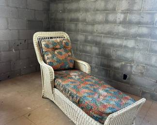 Vintage wicker chaise lounge.
