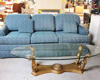 Blue sofa and glass coffee table