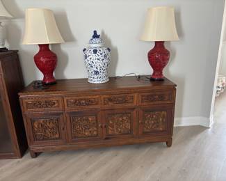 Four carved drawers and cabinet doors on bottom piece of china cabinet