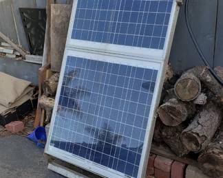 2-50 Watt (100 watt total) Solar Panels with controllers mounted in aluminum frame.