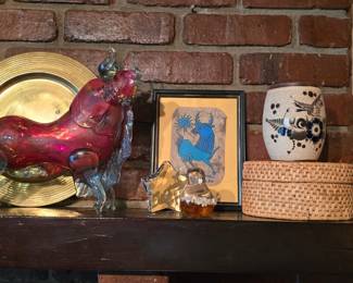 This mantle is in the basement, then to your left. Murano style glass bull.